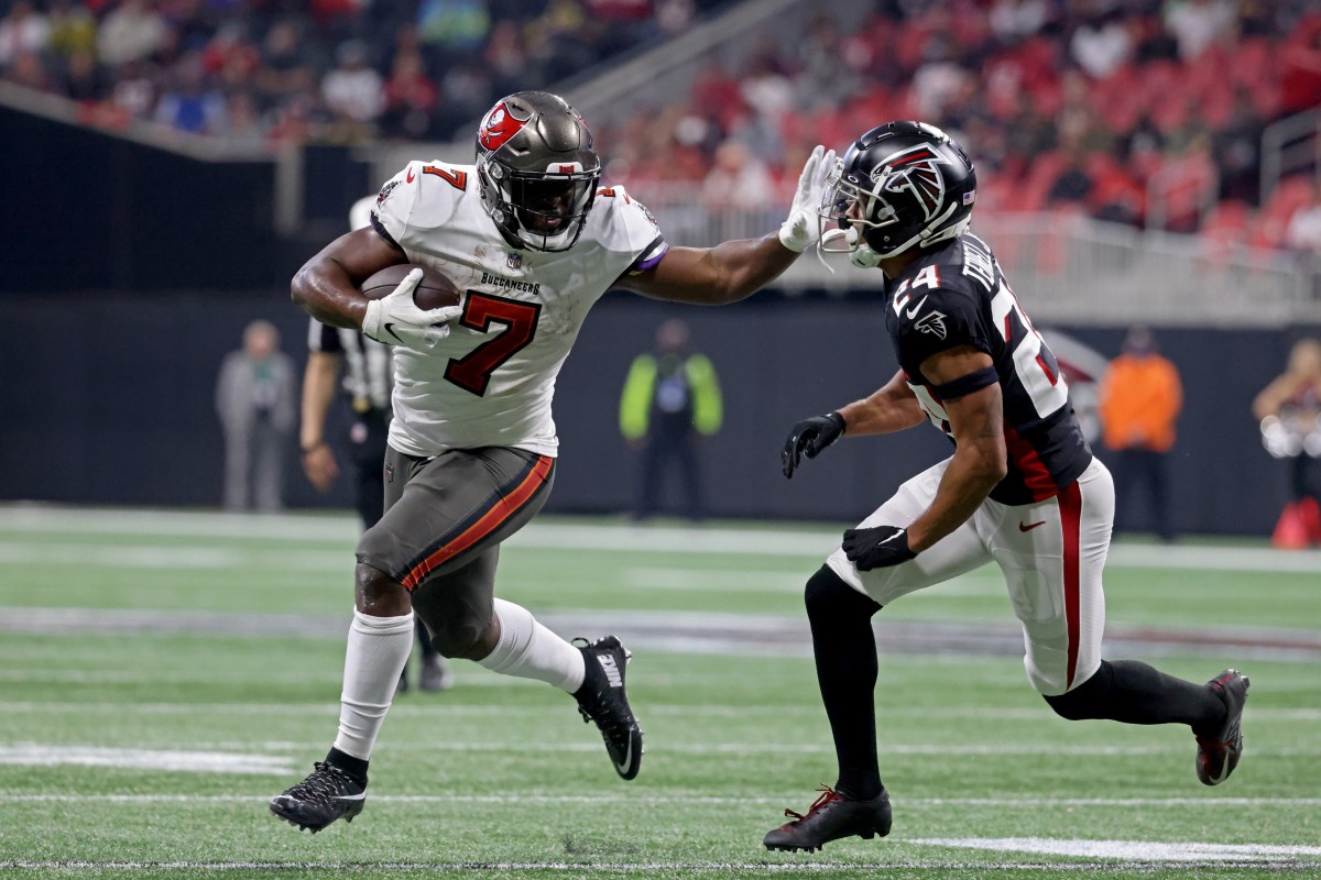 Tampa Bay Buccaneers running back Leonard Fournette (7) runs through Atlanta Falcons cornerback A.J. Terrell (24). Mandatory Credit: Jason Getz-USA TODAY Sports